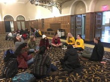 group of students sitting on the floor of the iowa memorial union